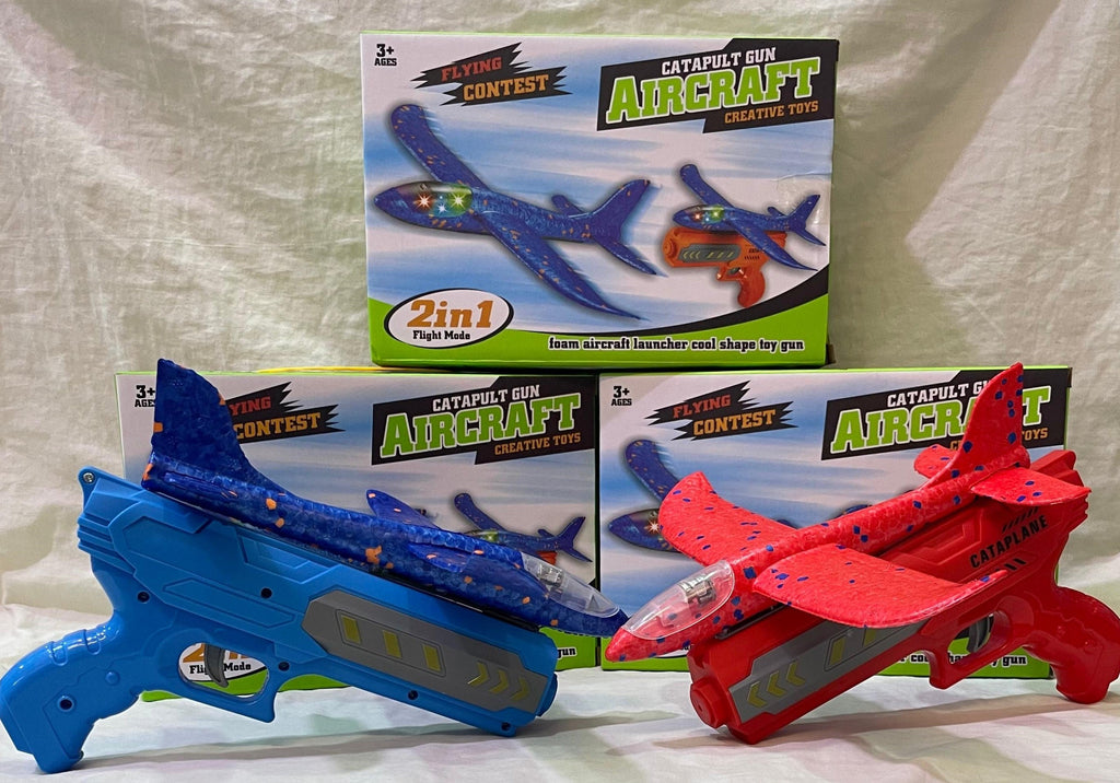 Toy catapult Gun Aircraft set with packaging on a textured surface